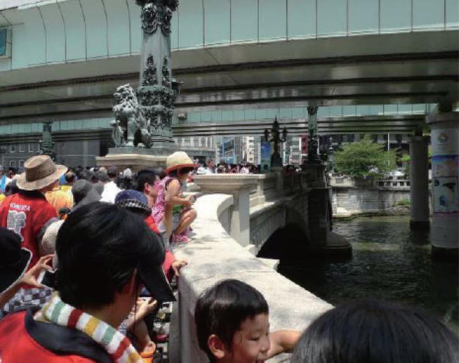 The Historic Bridge "Nihonbashi" Preservation Society. Throwing EM Mudballs into the river at the annual "Nihonbashi" cleanup event.